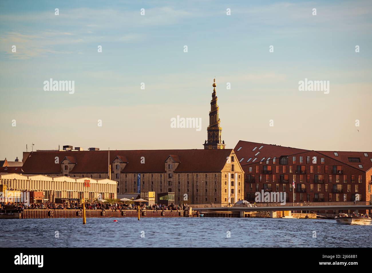 View from Canal in Copenhagen Vor Frelsers Kirke (Church of Our Saviour) tower as backdrop in Christianshavn area. Stock Photo