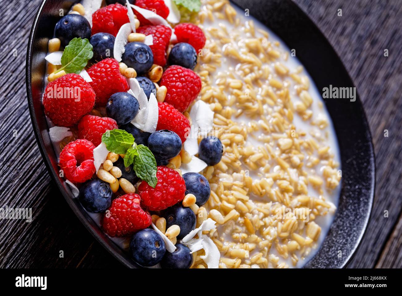 hulled whole-grain oat porridge cooked with coconut milk topped with ...