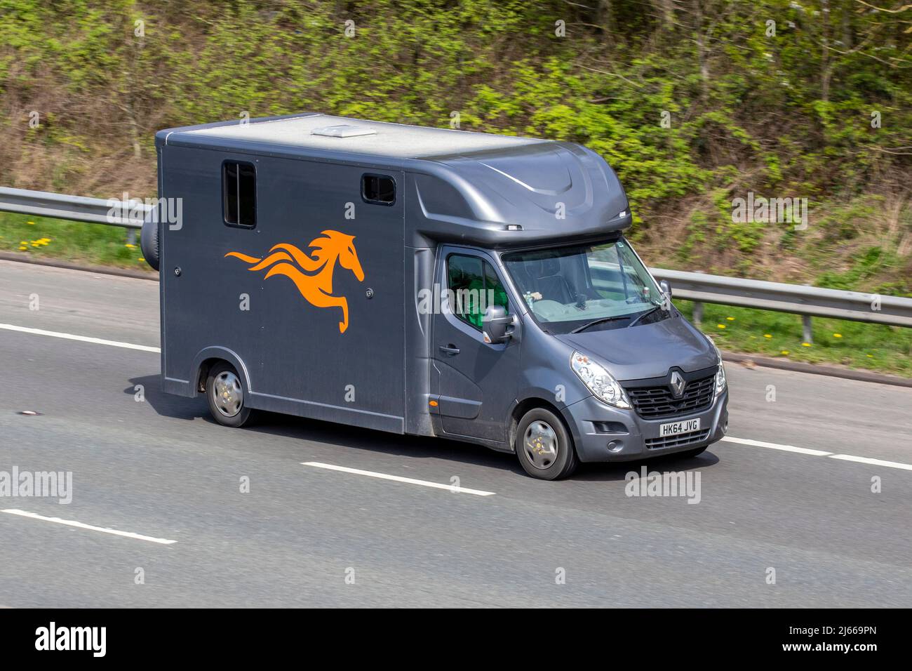 2014 Renault Master Lm35 L3H2 LWB grey LCV Medium Roof Panel Van 2298cc diesel horsebox van; Coach built van conversion equine animal transport travelling driving on the M61 motorway UK Stock Photo