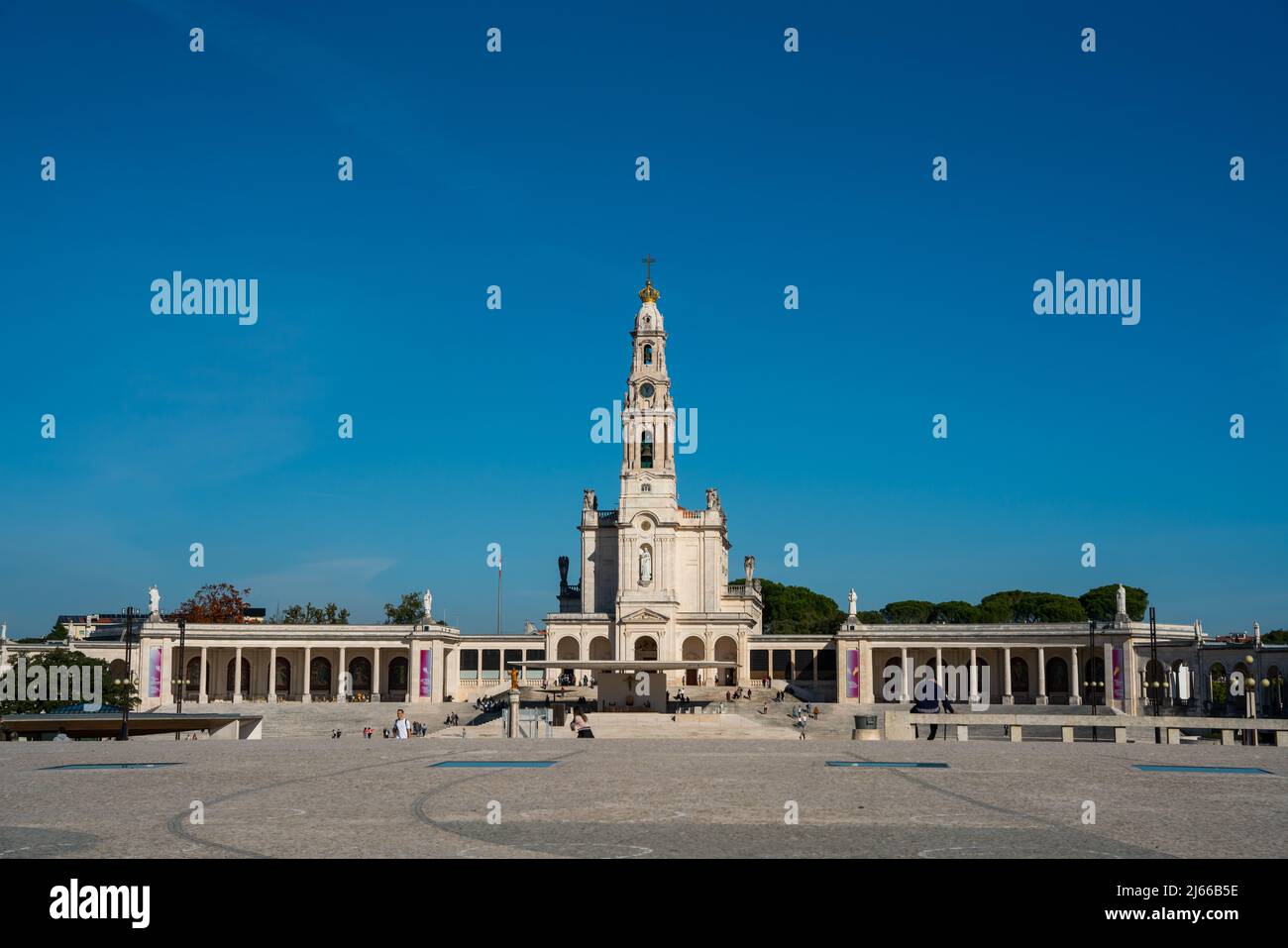 Fatima, Portugal - november 13 2022 - People passing the square in front of the Basilica of Our Lady of the Rosary of Fatima Stock Photo