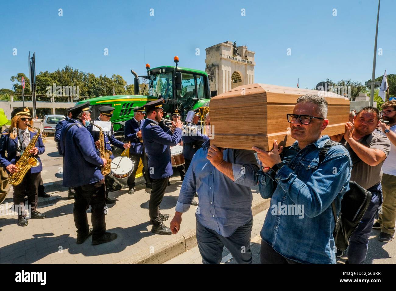 The Coordinamento Unitario in Difesa del Patrimonio Bufalino (United Coordination in Defence of the Bufalino Heritage) staged a funeral procession with tractors, a band and coffin to protest against the slaughter of 140,000 animals since 2014 for allegedly having contracted brucellosis, in front of the local health authority of caserta Stock Photo