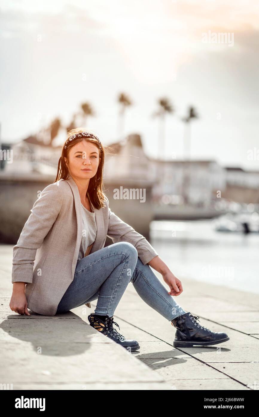 A portrait of a young woman enjoying time outdoor in marina Stock Photo