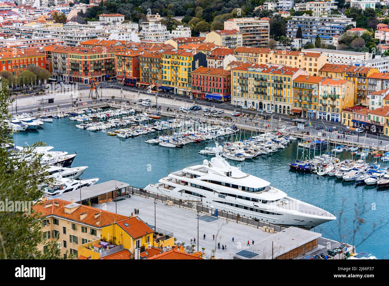 Nice, France - April 3 2022 - Overview of boats waiting for a sail in the Lympia port (porte de Nice Lympia) with very big ship Stock Photo