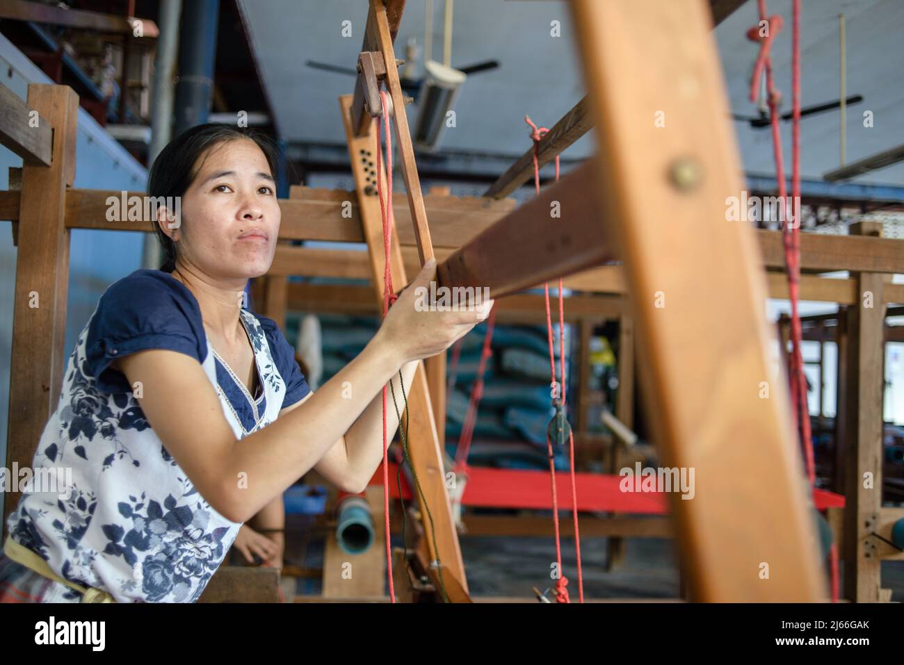 Silk weaving process at the Mai Savanh Lao workshop  in Vientiane, Laos Stock Photo