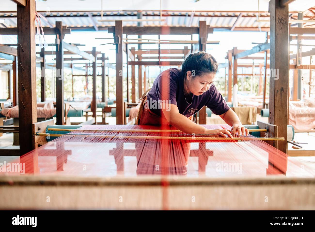 Silk weaving process at the Mai Savanh Lao workshop  in Vientiane, Laos Stock Photo