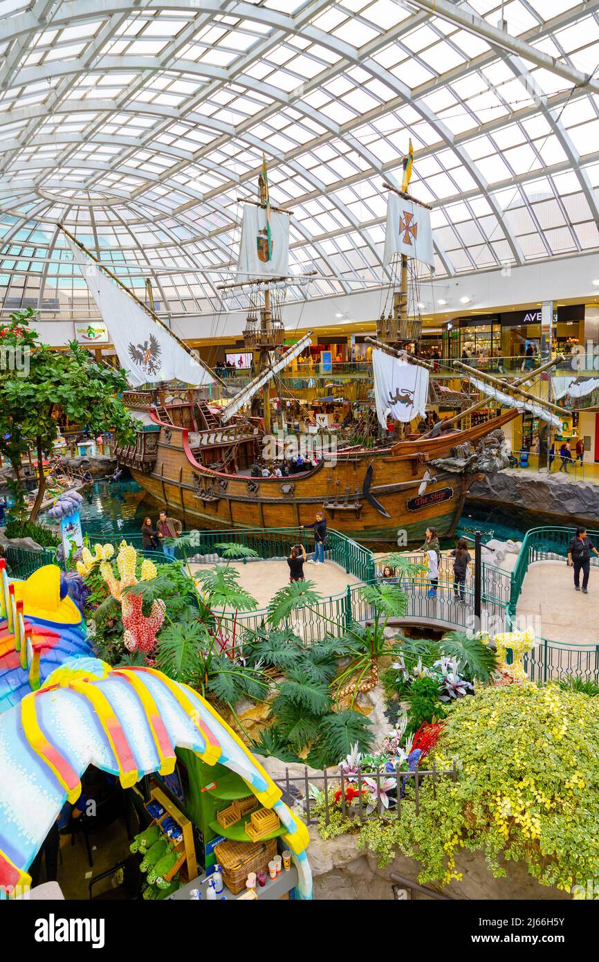 EDMONTON, CANADA - APRIL 16, 2022: Shoppers visit the West Edmonton Mall in Alberta, Canada. At 5.3 million sq ft, it is the second largest shopping m Stock Photo