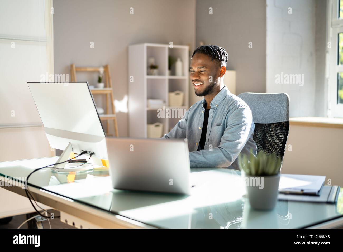 Man At Workplace. Manager Doing Business Communication In Office Stock Photo
