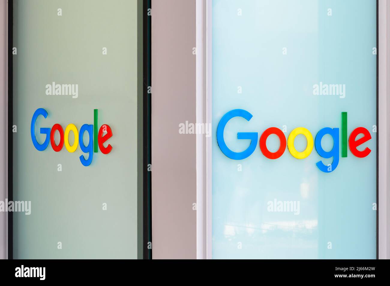 Google logos on a glass pane. Stock Photo