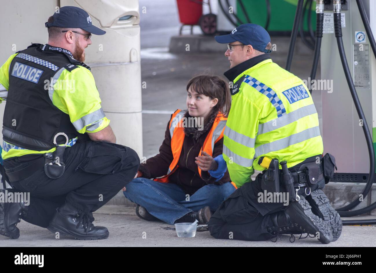 Kent, UK.  28 April 2022 Protesters from Just Stop Oil blockade the BP garage at Clacket Lane Services on the M25. Police arrive to unglue and arrest all of the protesters. Credit: Denise Laura Baker/Alamy Live News Stock Photo