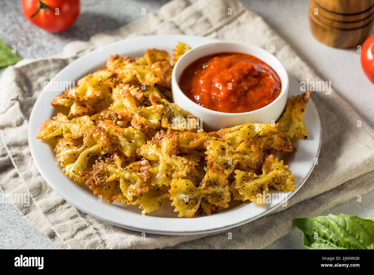 Homemade Trendy Pasta Chips with Marinara Sauce Stock Photo Alamy
