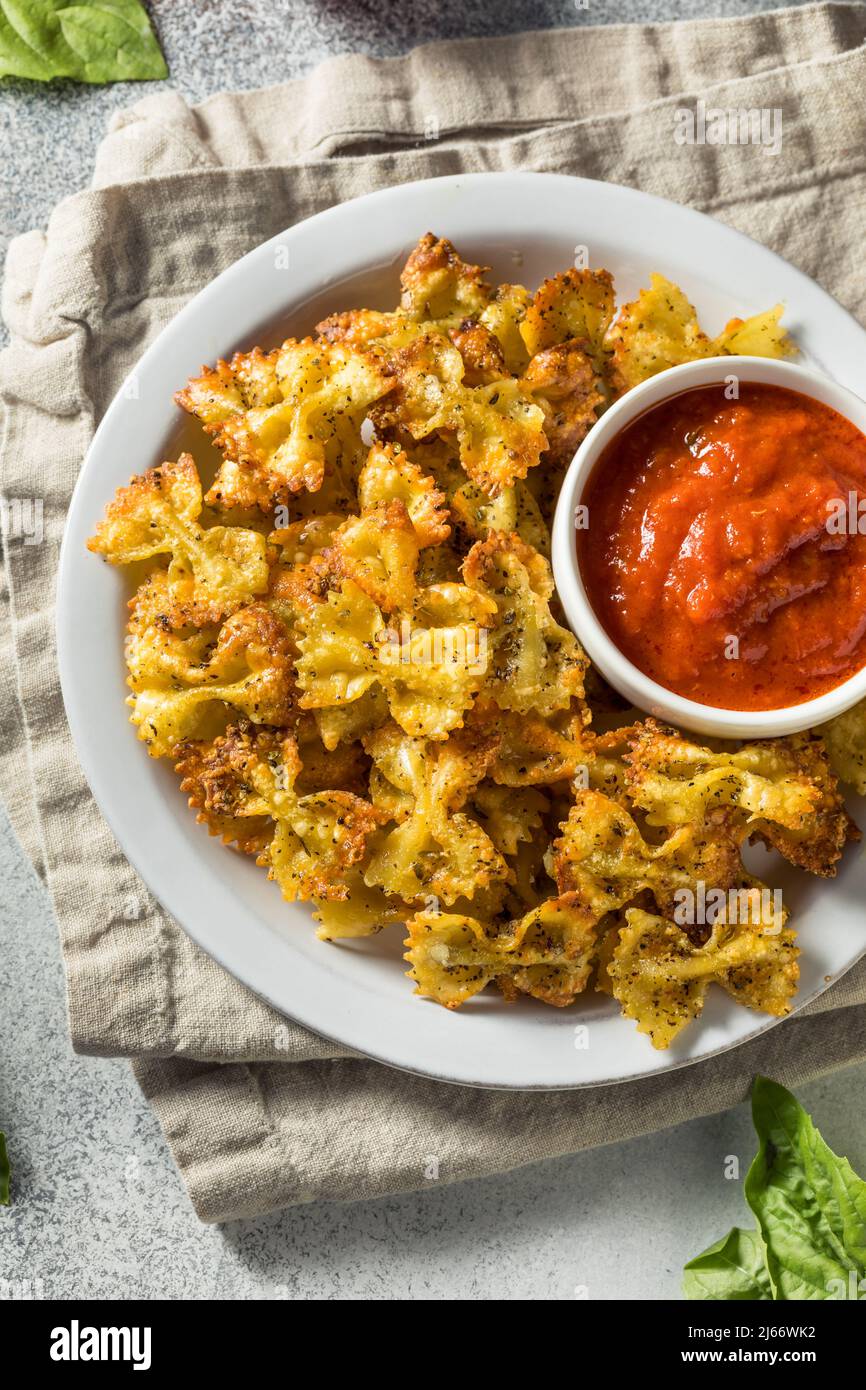 Homemade Trendy Pasta Chips with Marinara Sauce Stock Photo Alamy