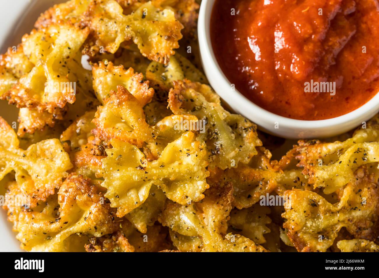Homemade Trendy Pasta Chips with Marinara Sauce Stock Photo Alamy