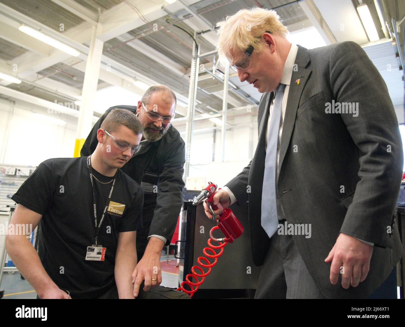 Britain's Prime Minister Boris Johnson holds a rivet gun during a campaign visit to Burnley College Sixth Form Centre in Burnley, Lancashire, Britain April 28, 2022. Peter Byrne/Pool via REUTERS Stock Photo