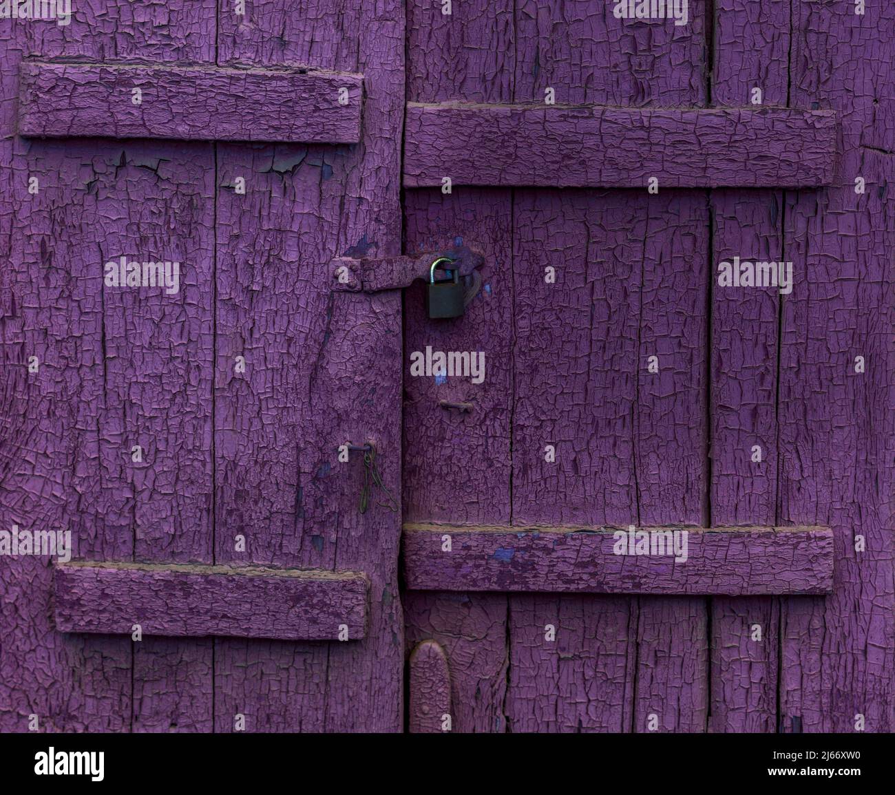 Old purple closed shutters Stock Photo