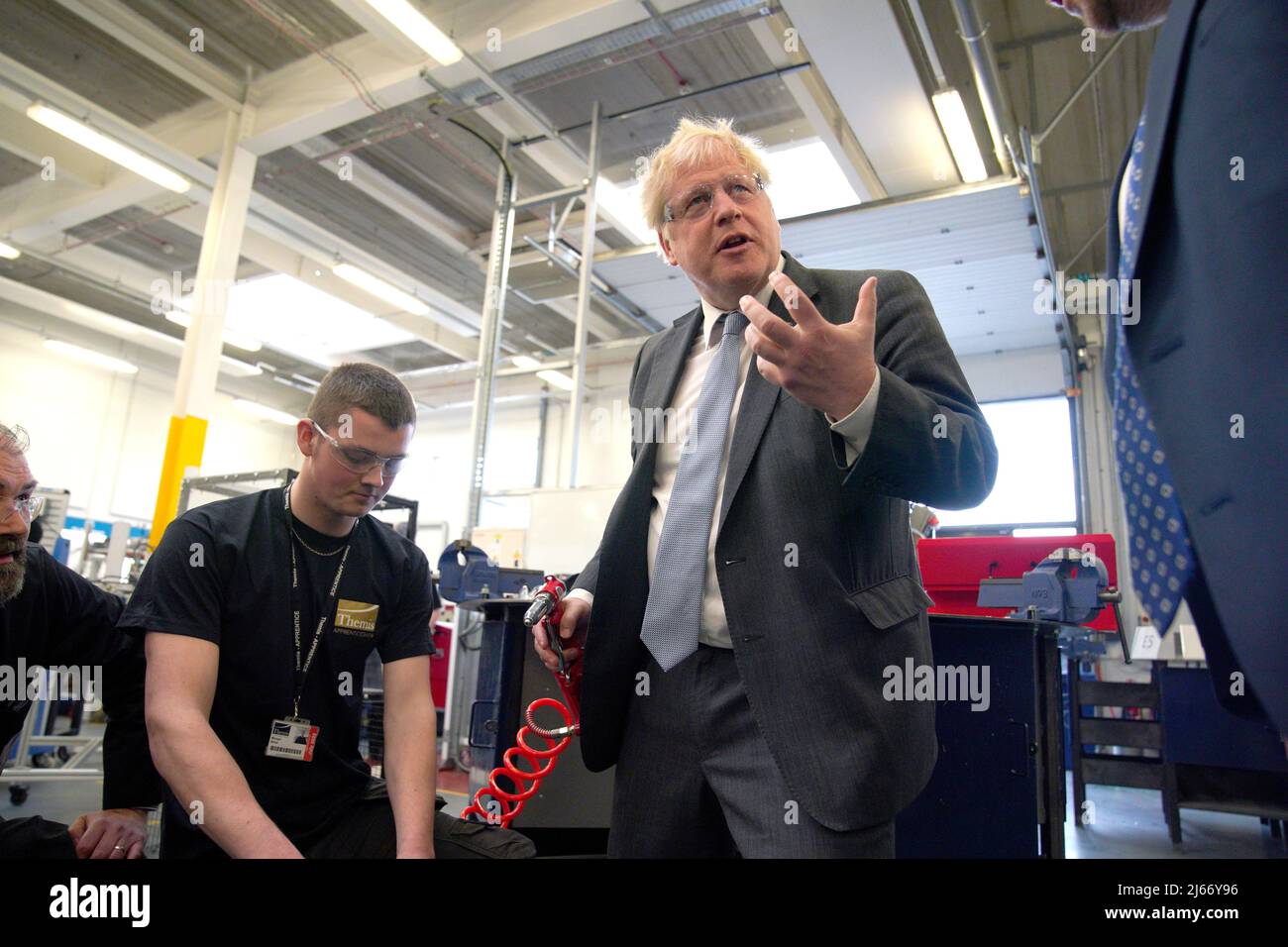 Britain's Prime Minister Boris Johnson holds a rivet gun during a campaign visit to Burnley College Sixth Form Centre in Burnley, Lancashire, Britain April 28, 2022. Peter Byrne/Pool via REUTERS Stock Photo