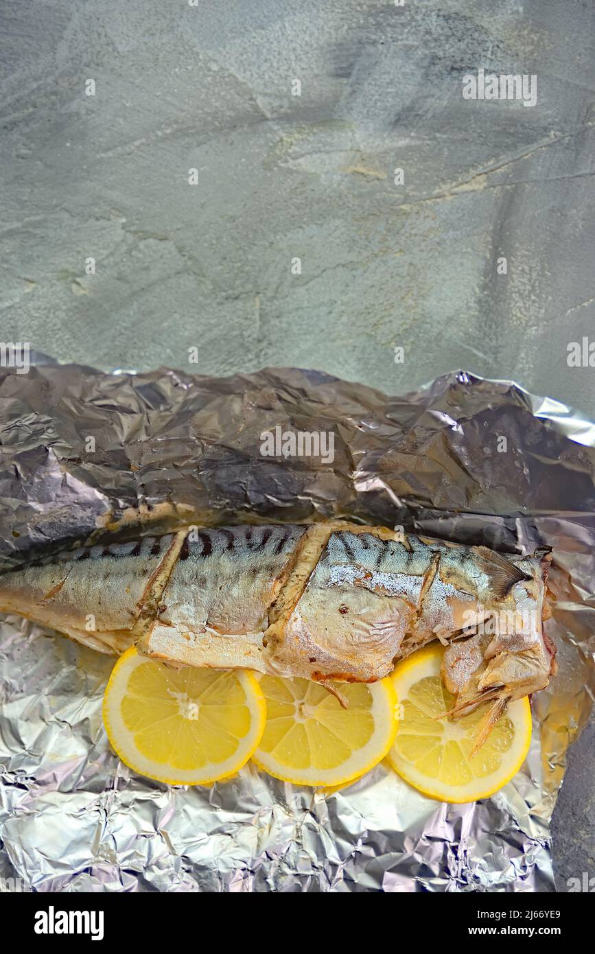 baked mackerel fish with lemon in foil Stock Photo Alamy