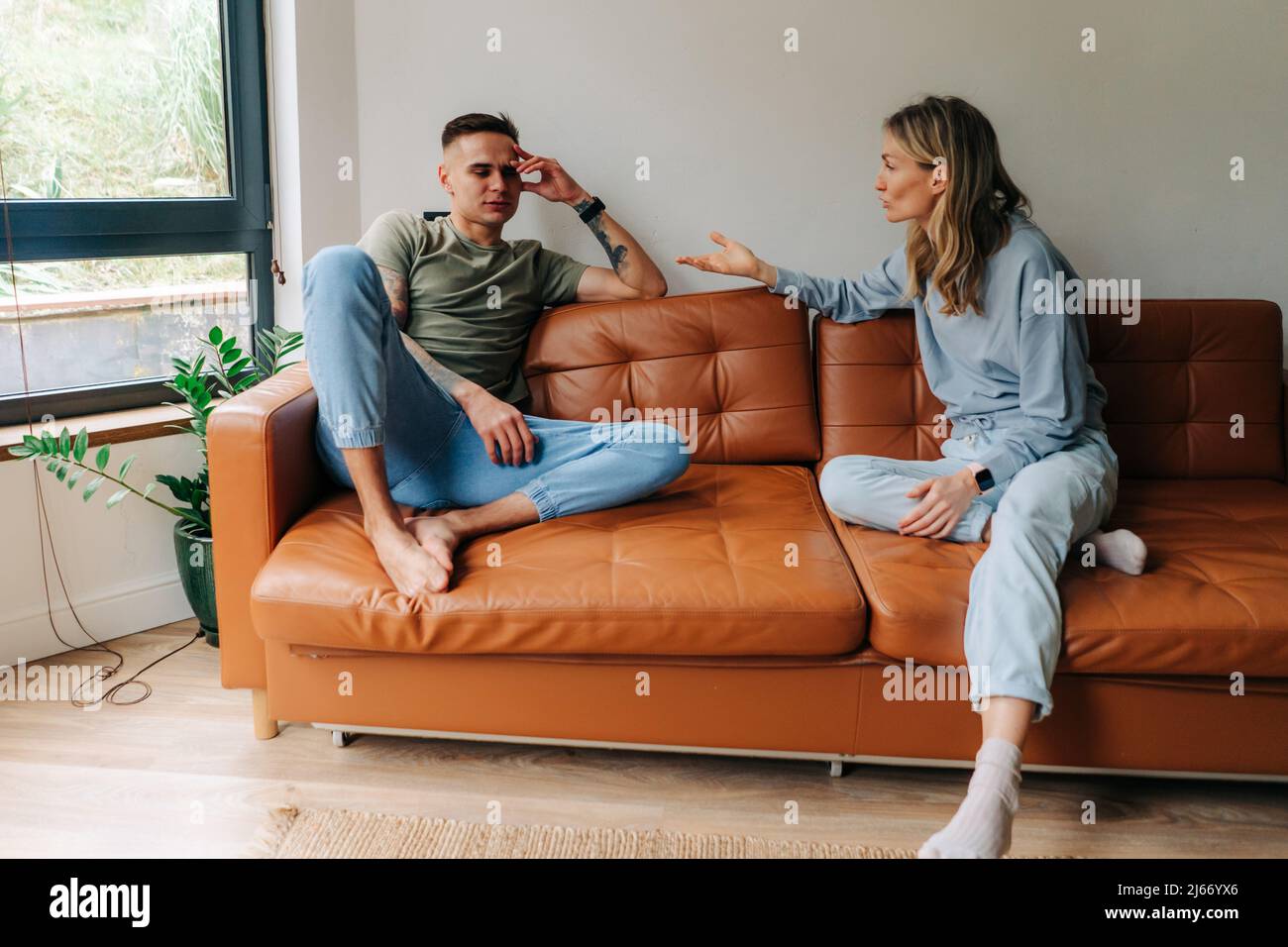 Young woman quarreling with her boyfriend, relationship problems. Stock Photo
