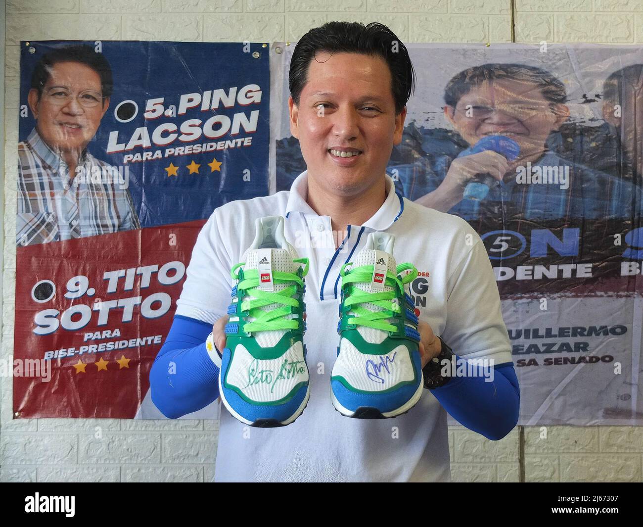 Movie actor Kier Legaspi, seen showing his customized Adidas shoes with the  signatures of Senator Ping Lacson and Senate President Tito Sotto.  Presidential and Vice Presidential candidate Panfilo "Ping" Lacson and  Senate