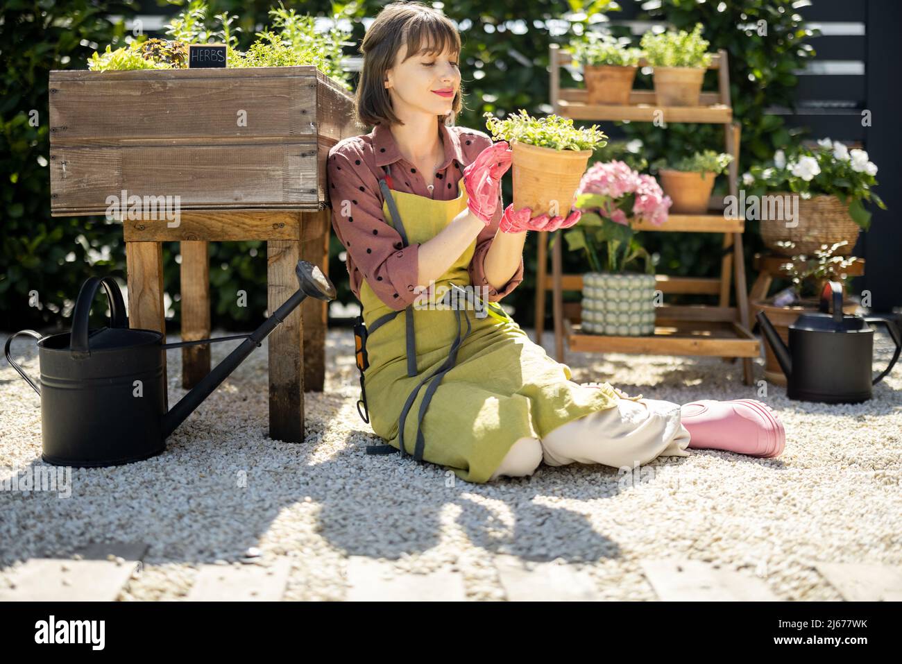 Portrait of young gardener at backyard Stock Photo - Alamy