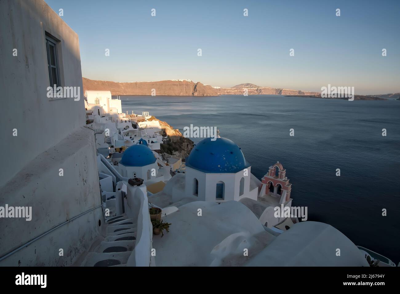 View of the whitewashed and picturesque small houses and hotels of Oia Santorini Stock Photo