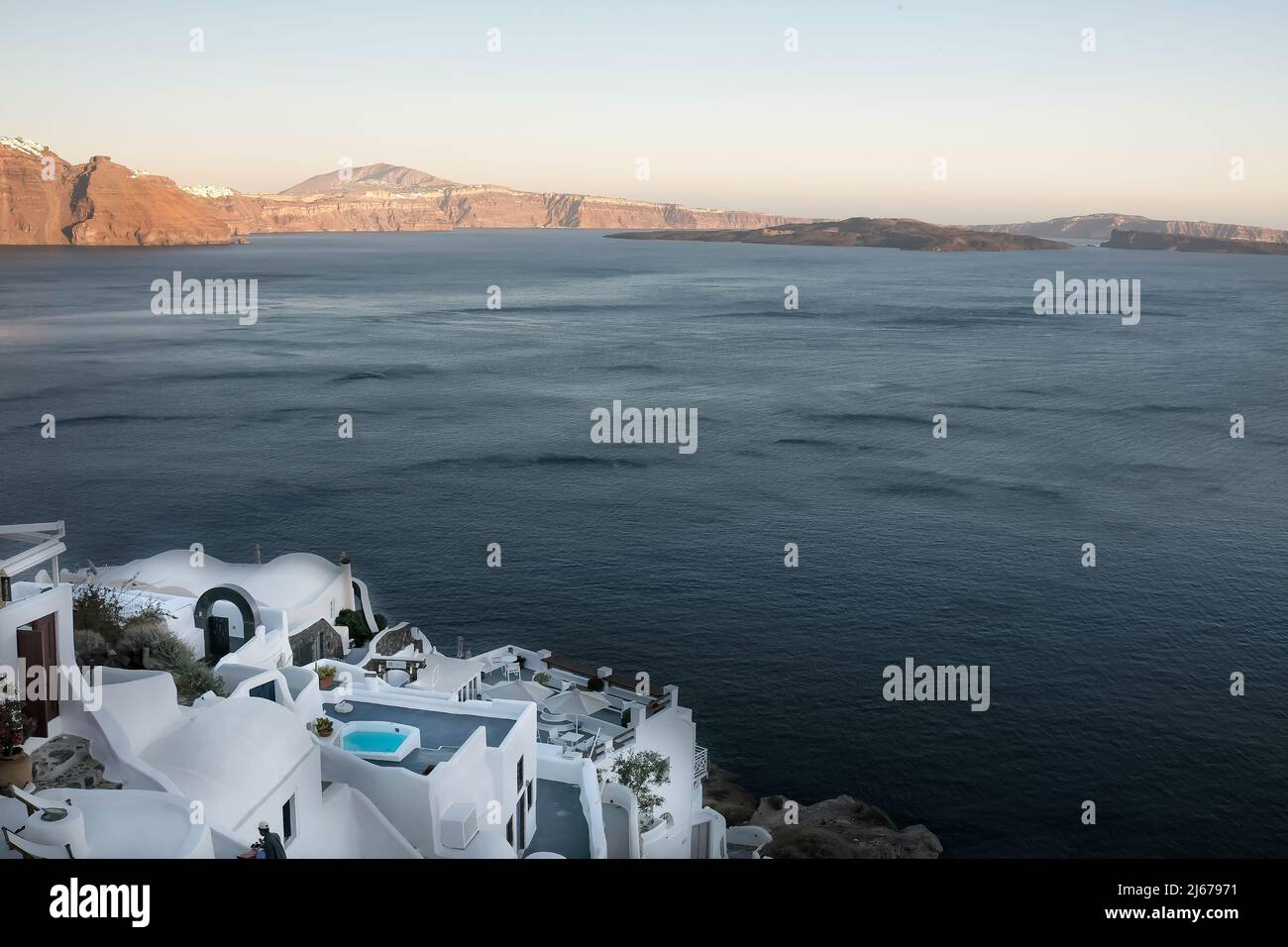 View of the whitewashed and picturesque small houses and hotels of Oia Santorini Stock Photo