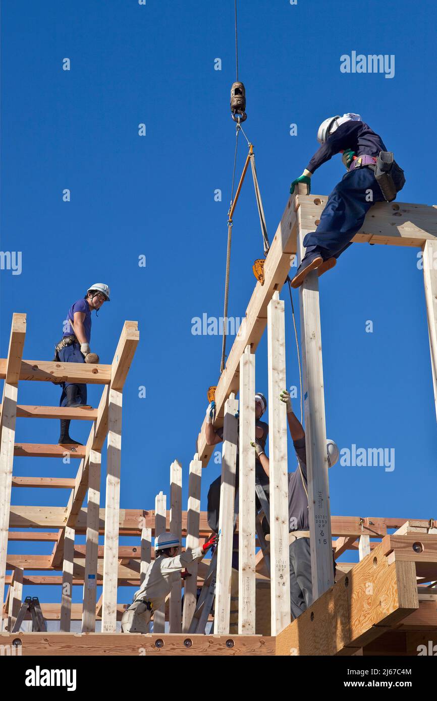 Carpenters work on prefabricated house construction in Ontakesan, Tokyo, Japan Stock Photo