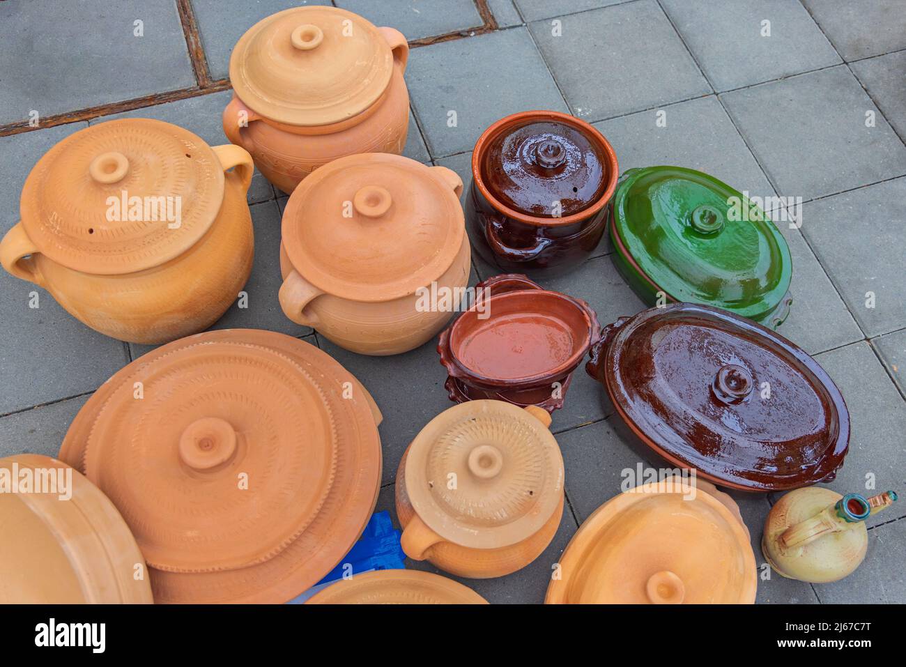 Pottery For Cooking Collection of Earthenware Jugs With Lids Stock