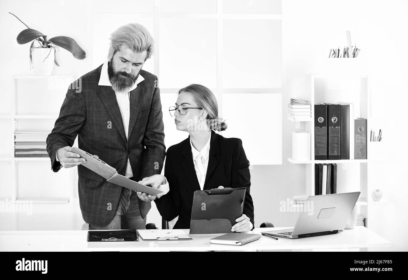Stressful day at the office. male boss with his secretary. office couple discuss business