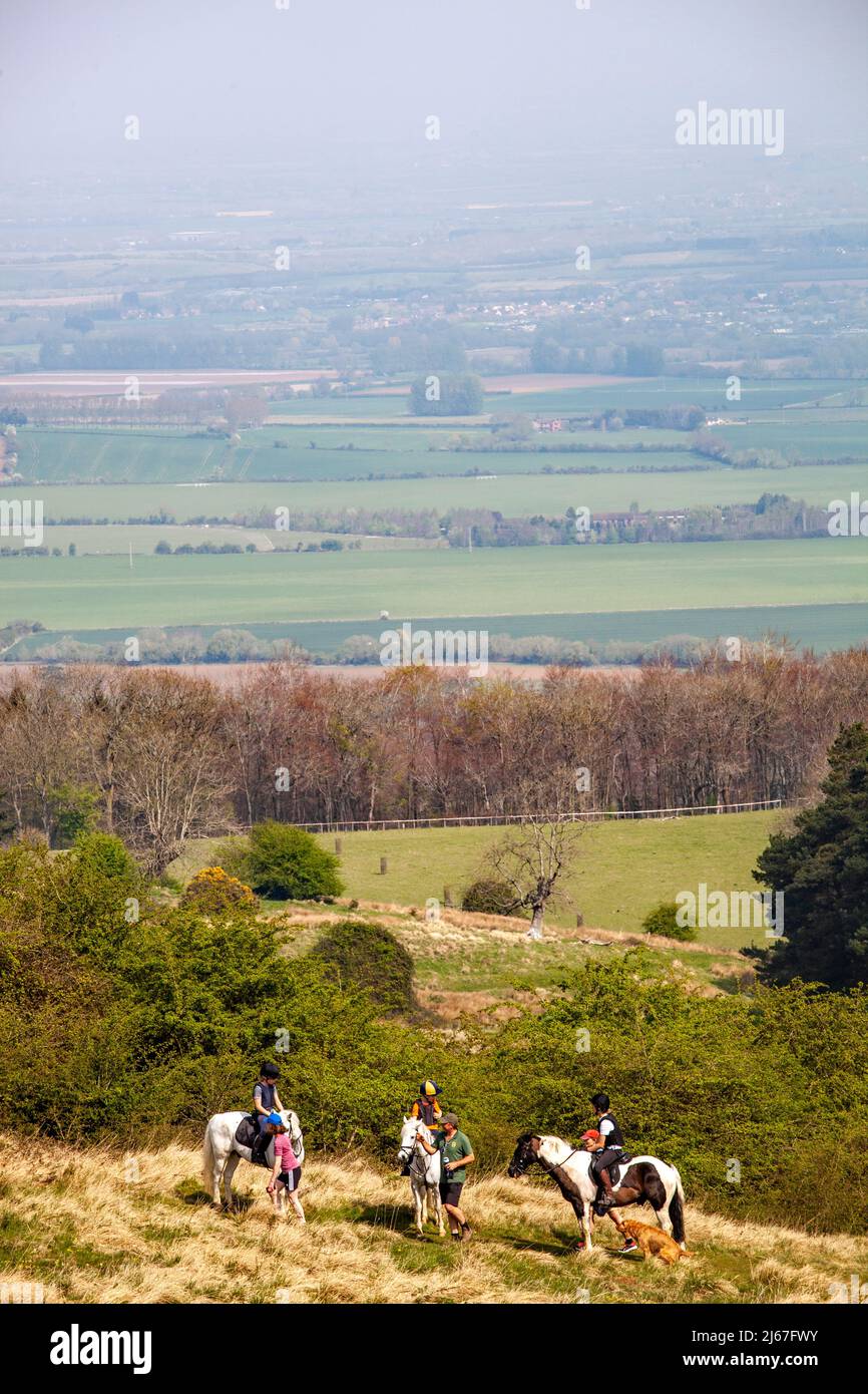 Horse riders riding ponies on the Bredon Hills in the Vale of Evesham