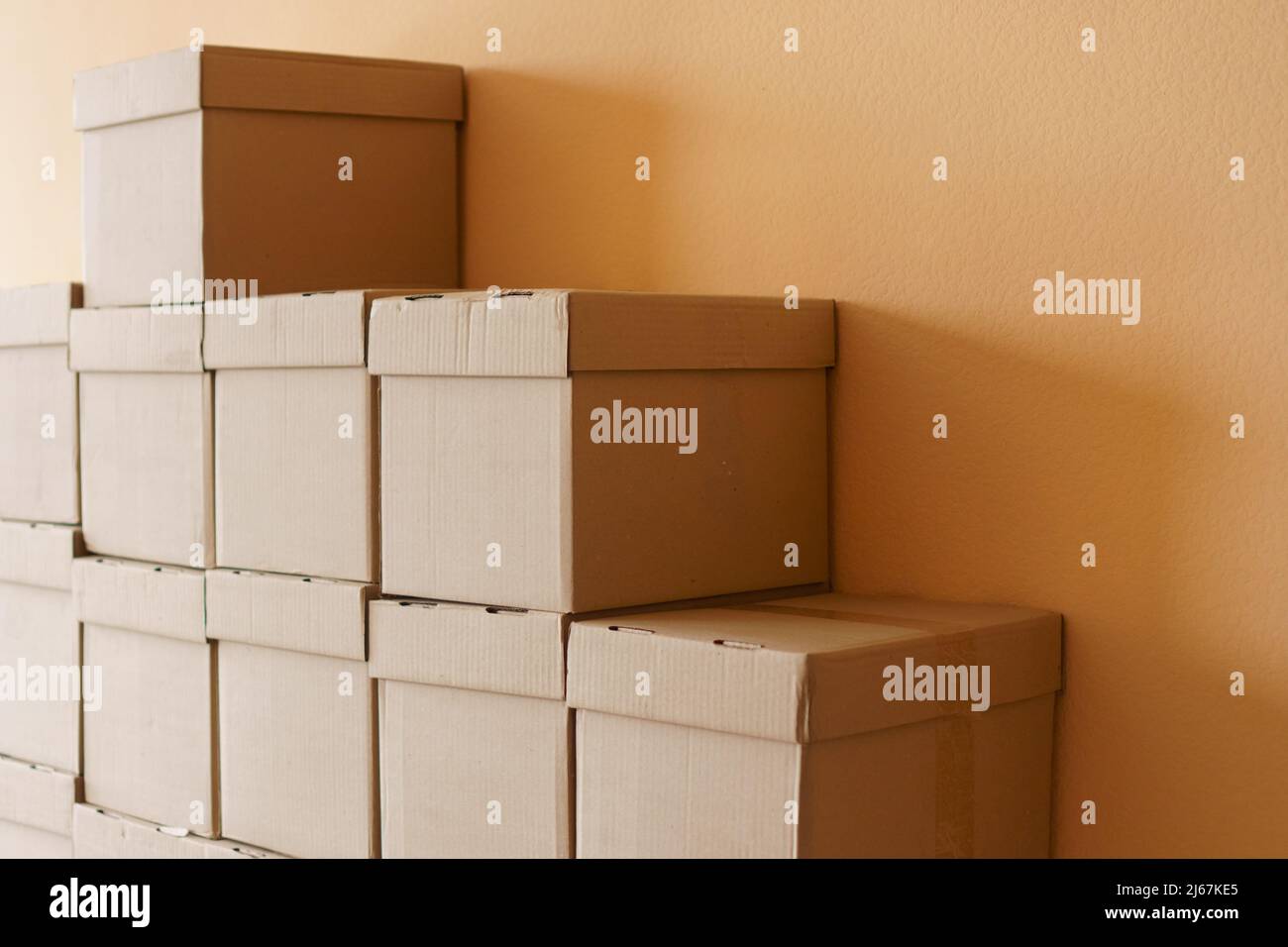 Set of cardboard brown boxes in storehouse. Background of carton boxes