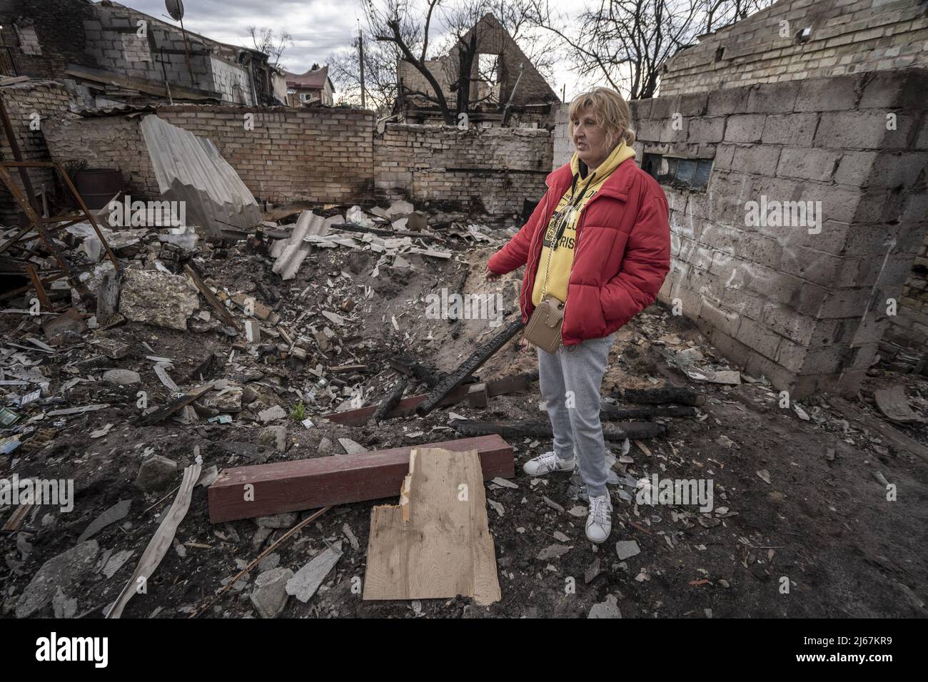 Irpin, Ukraine. 28th Apr, 2022. Natalia Tsyukalo, 62, demonstrates how she hid in her cellar from the Russian shelling that hit the apartments across the street from her home in Irpin, Ukraine April 27, 2022. The United States has credible evidence of Russian troops executing surrendering Ukrainians in Donetsk region, a U.S. official told U.N. member states seeking to hold those responsible for war crimes committed by Russia to account. Credit: UPI/Alamy Live News Stock Photo