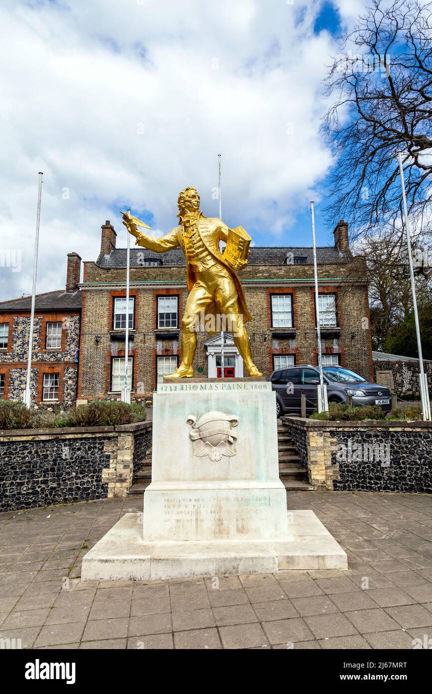 Golden statue of writer and philosopher Thomas Paine by Charles Wheeler outside King's House in Thetford, Norfolk, UK Stock Photo