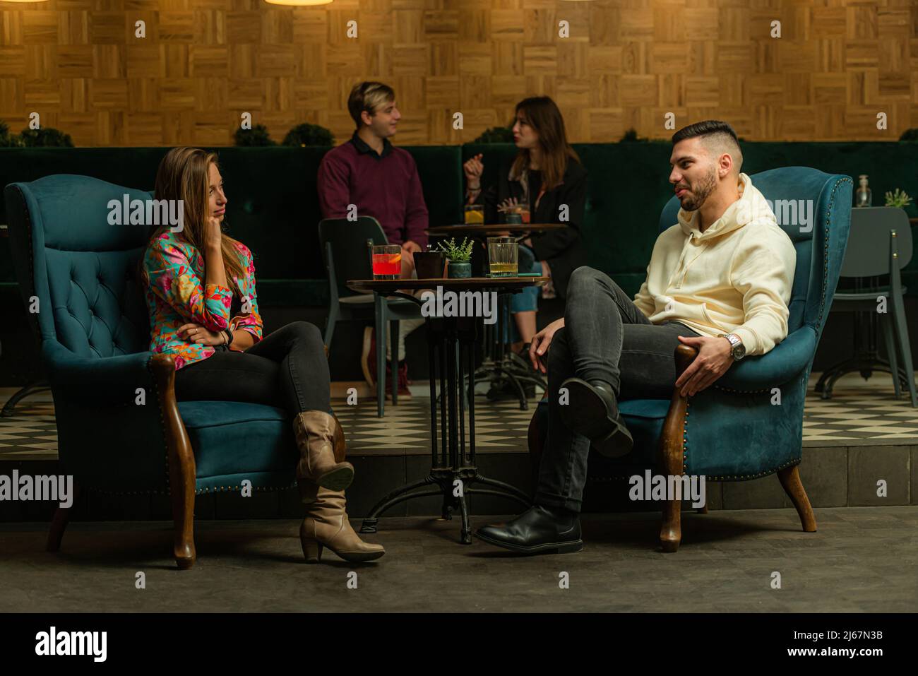 Two amazing and beautiful couples are talking to each other while