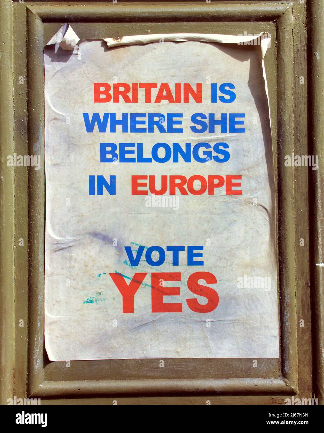 distressed vintage vote for european union entry posters from 1970's  pasted on street furniture when Britain was joining eec Stock Photo