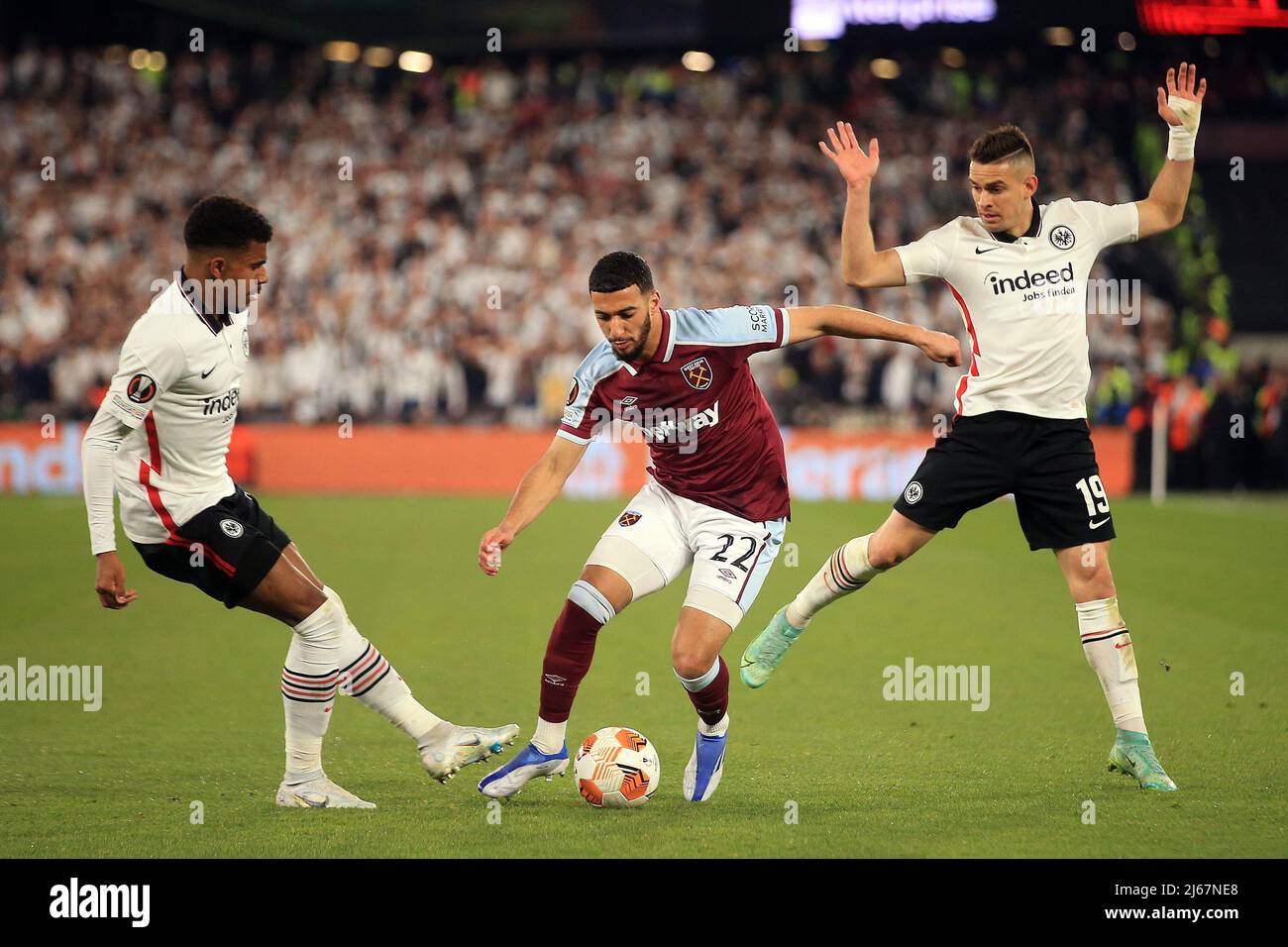 London, UK. 28th Apr, 2022. Said Benrahma of West Ham United (M) in action with Rafael Santos Borre of Eintracht Frankfurt (R) and Gonçalo Paciencia of Eintracht Frankfurt (L).  UEFA Europa league match, semi final, 1st leg,  West Ham Utd v Eintracht Frankfurt at the London Stadium, Queen Elizabeth Olympic Park in London on Thursday 28th April 2022.  this image may only be used for Editorial purposes. Editorial use only, license required for commercial use. No use in betting, games or a single club/league/player publications. pic by  Steffan Bowen/Andrew Orchard sports photography/Alamy Live n Stock Photo