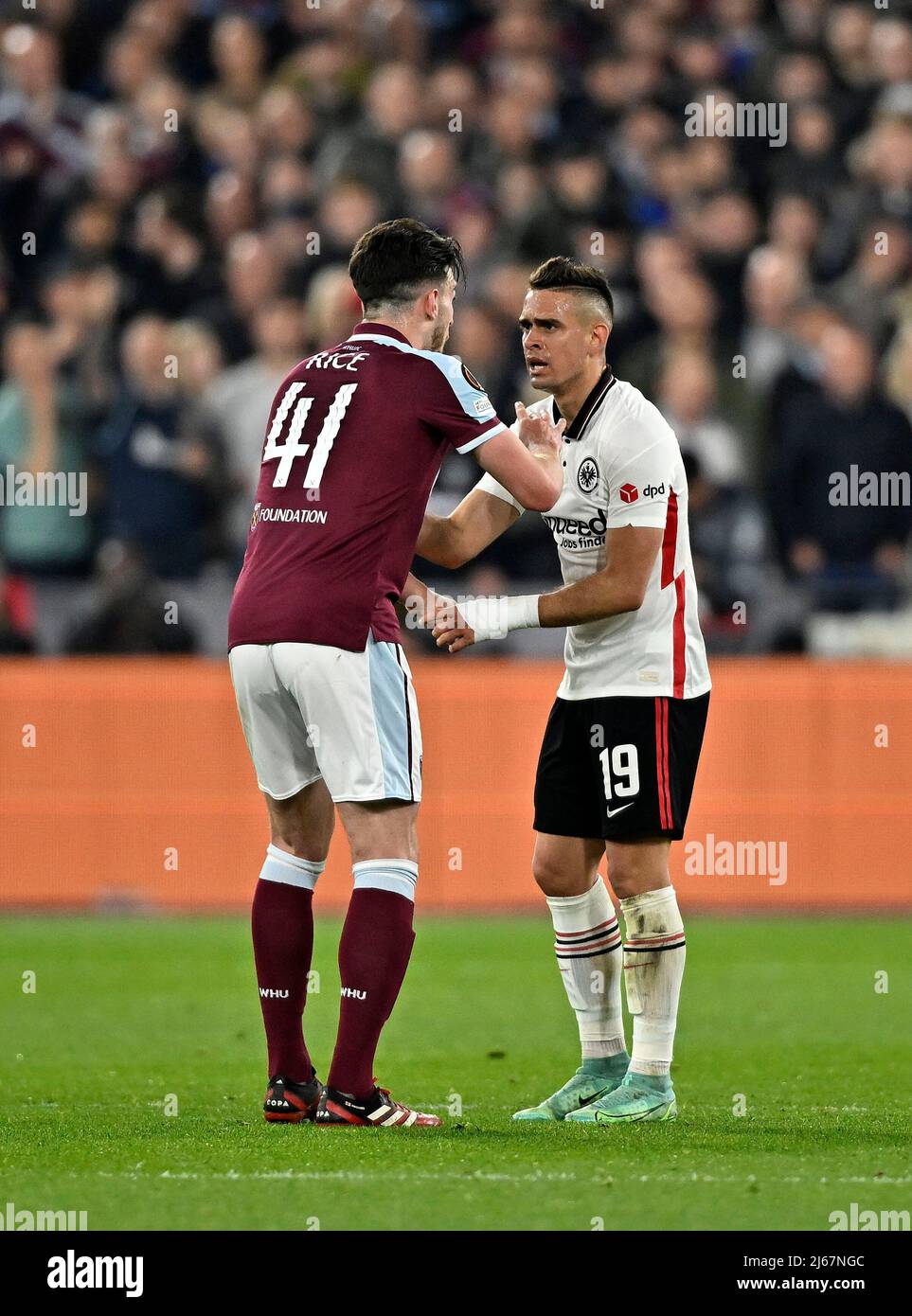 London UK 28th April 2022. Declan Rice (West Ham) and Rafael Santos Borre (Frankfurt) have words during the West Ham vs Eintracht Frankfurt Uefa Europa Cup semi final 1st leg match at the London Stadium, Stratford.Credit: Martin Dalton/Alamy Live News. This Image is for EDITORIAL USE ONLY. Licence required from the the Football DataCo for any other use. Credit: MARTIN DALTON/Alamy Live News Stock Photo