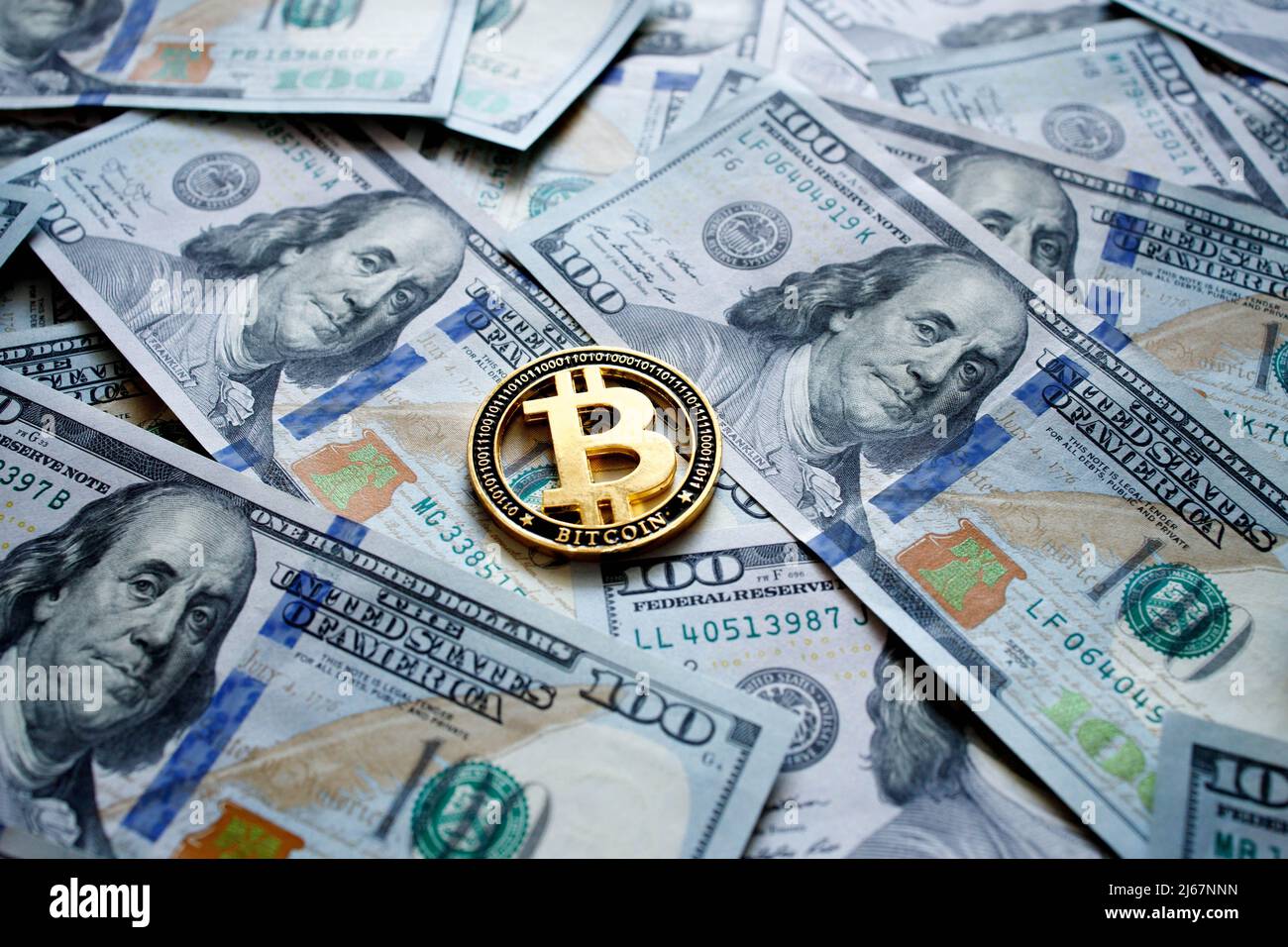 Close up Golden bitcoin crypto currency coins on US dollar bills.  Electronic decentralized money concept Stock Photo - Alamy