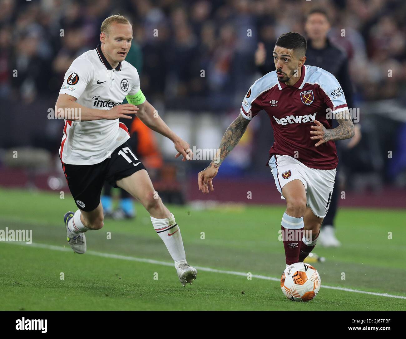 London, UK. 28th April 2022. Manuel Lanzini of West Ham United and Sebastian Rode of Eintracht Frankfurt challenge for the ball during the UEFA Europa League match at the London Stadium, London. Picture credit should read: Paul Terry / Sportimage Credit: Sportimage/Alamy Live News Stock Photo