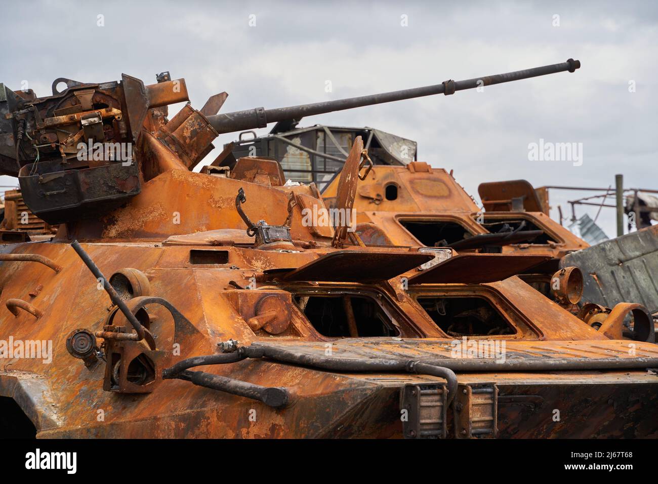 destroyed Russian tank. Russian tank at the cemetery of Russian equipment in Ukraine. Burnt Russian fuel truck. War in Ukraine 2022. destroyed armored Stock Photo