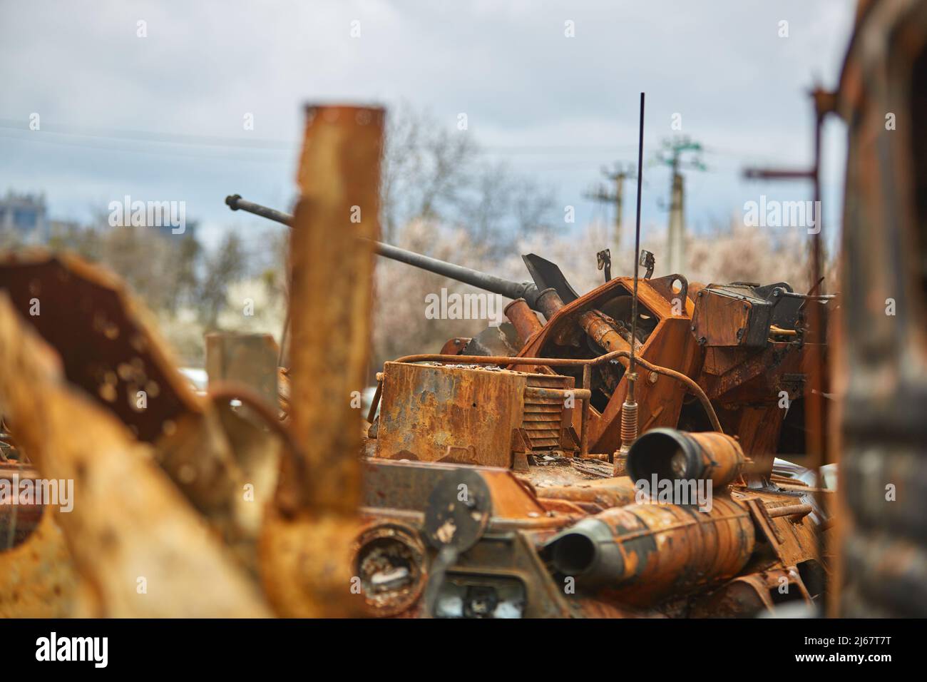 destroyed Russian tank. Russian tank at the cemetery of Russian equipment in Ukraine. Burnt Russian fuel truck. War in Ukraine 2022. destroyed armored Stock Photo