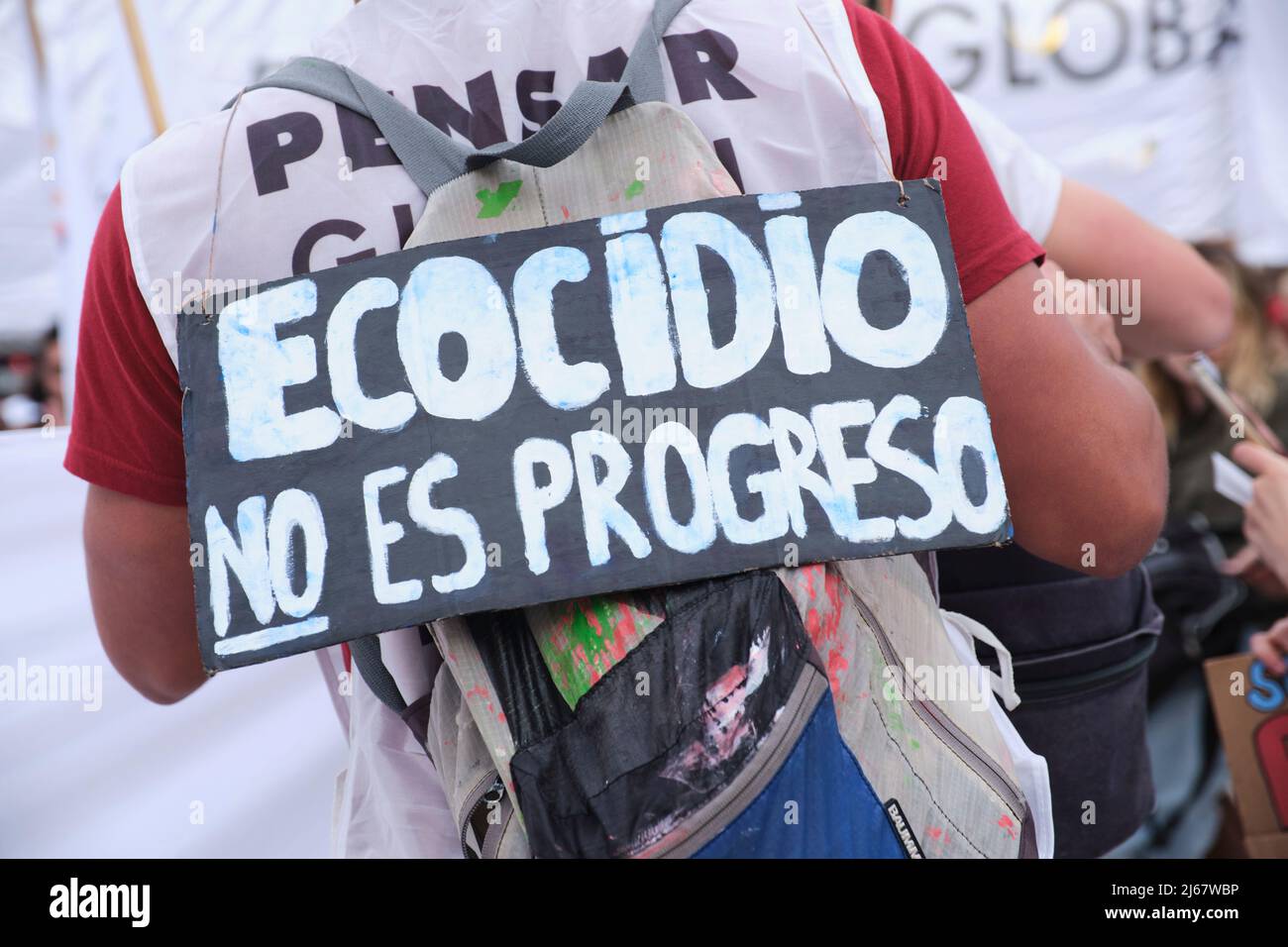 Buenos Aires, Argentina; April 22, 2022: Earth Day demonstration; poster with the message ecocide is not progress. Concepts: activism, environmentalis Stock Photo