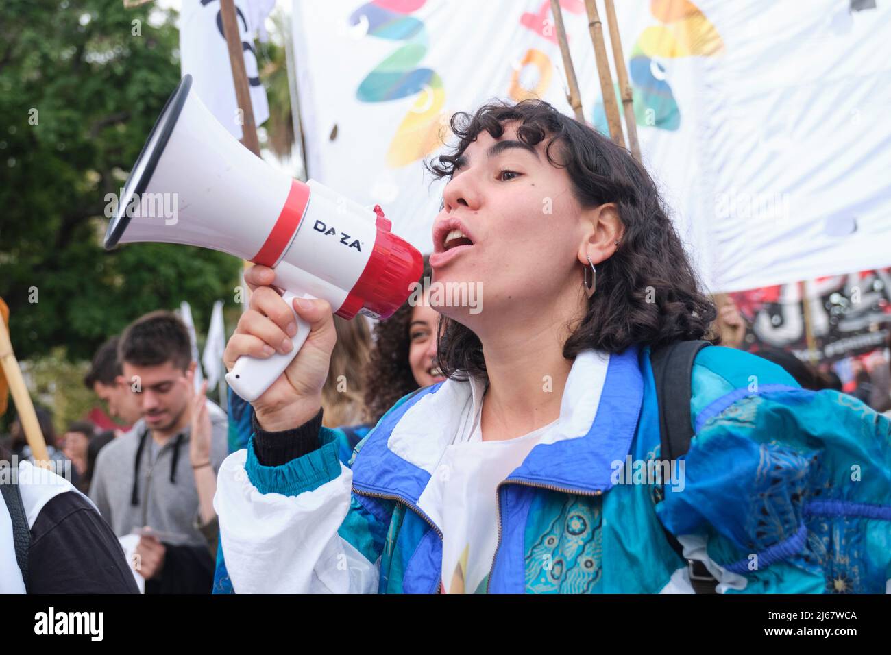 Buenos Aires, Argentina; April 22, 2022: Young activist with a megaphone shouting, cheering on an environmental collective during the Earth Day demons Stock Photo