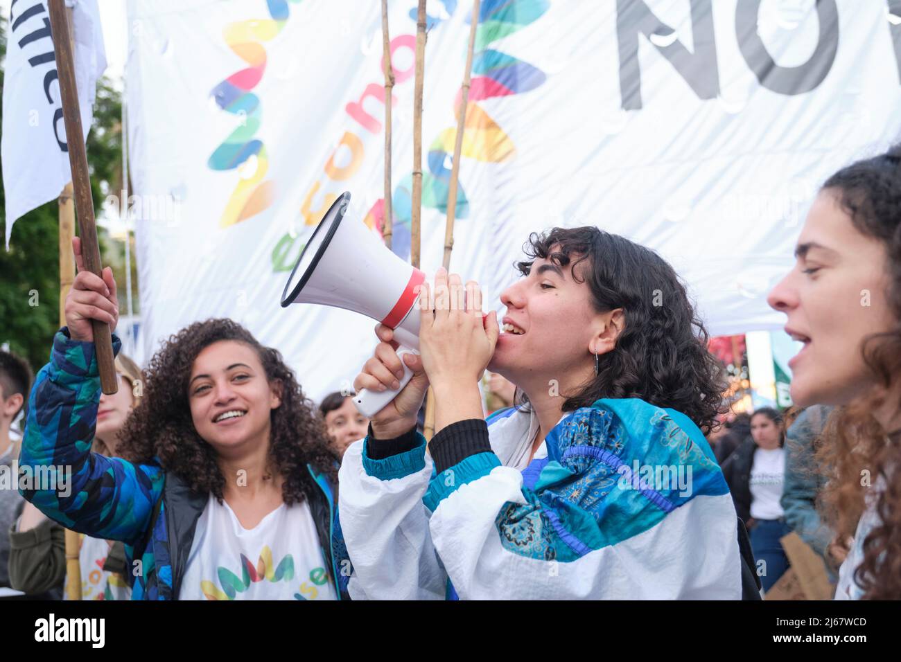 Buenos Aires, Argentina; April 22, 2022: Young activists, leader with a megaphone shouting, cheering on an environmental collective during the Earth D Stock Photo