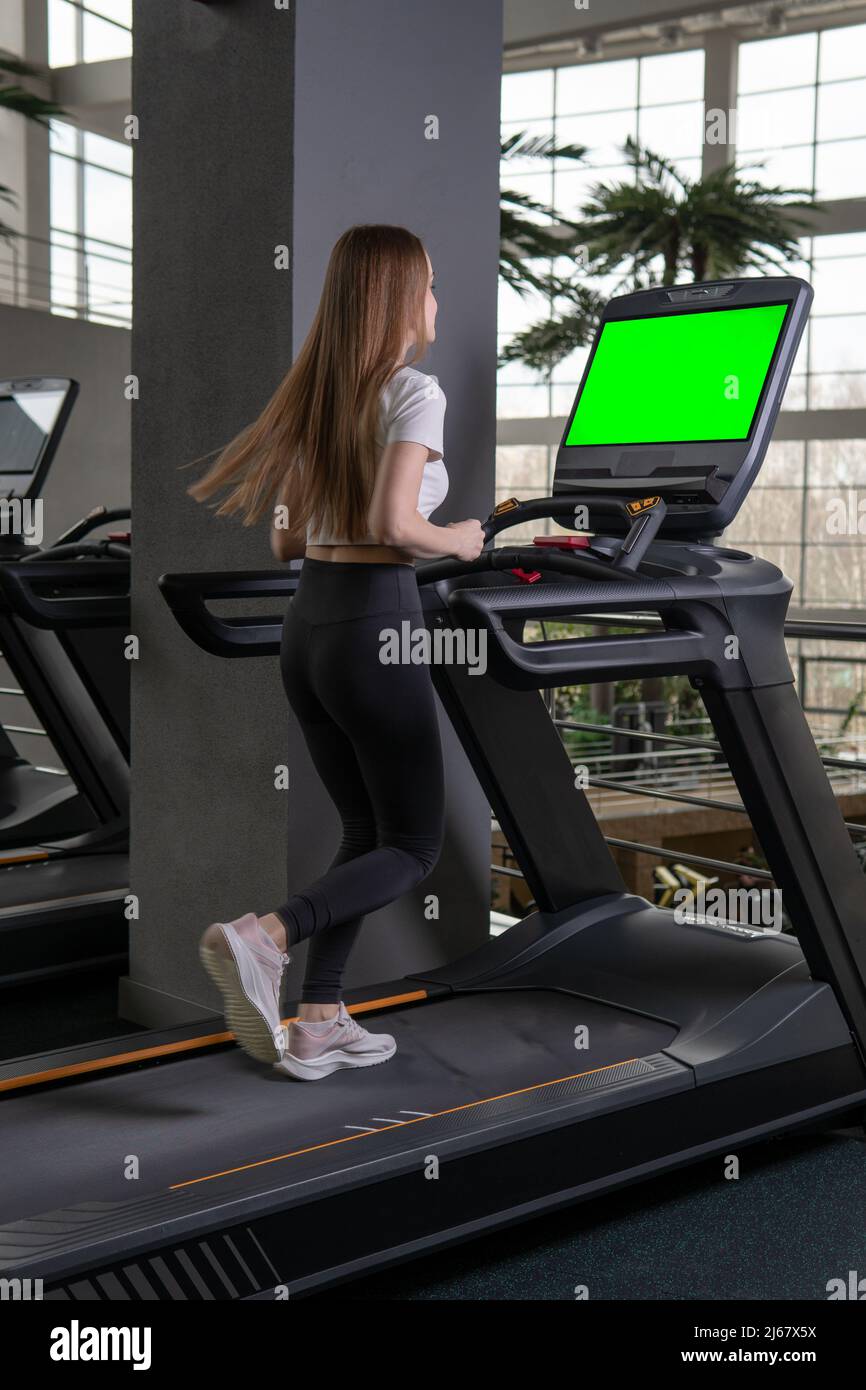 Woman length young indoors treadmill profile full running female, from workout attractive in caucasian for adult sporty, sportswoman together. White Stock Photo