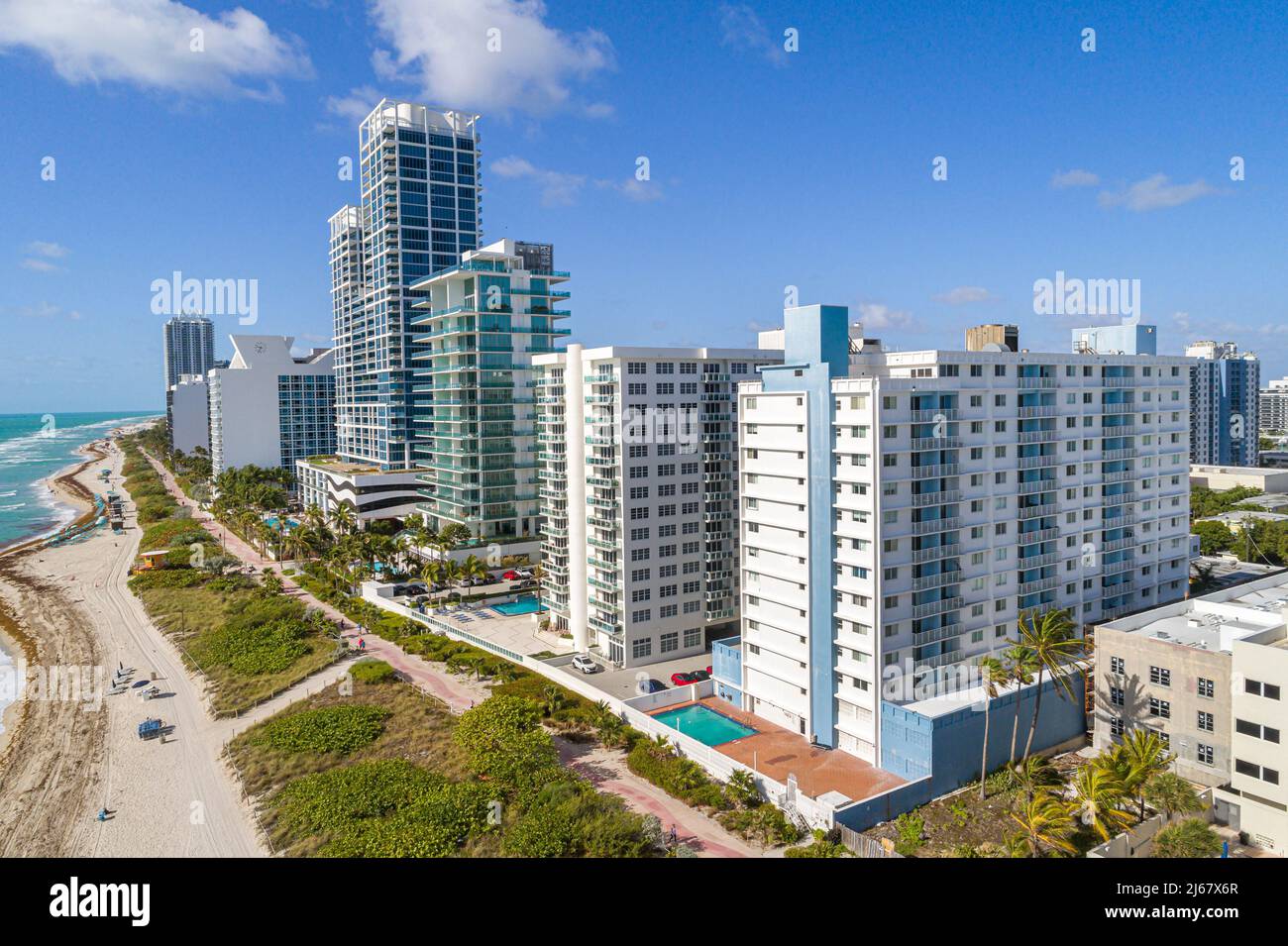 Miami Beach Florida waterfront oceanfront high rise apartment condominium buildings aerial overhead view from above The Collins L'Atelier Carillon Hot Stock Photo