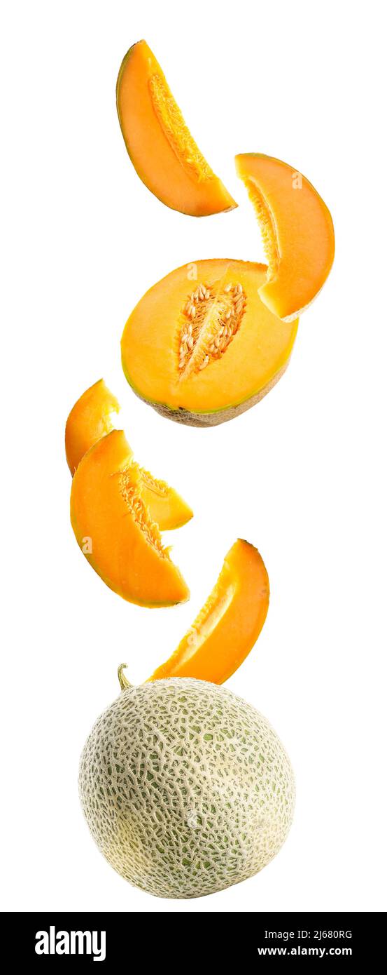 Flying ripe melons and slices isolated on white Stock Photo