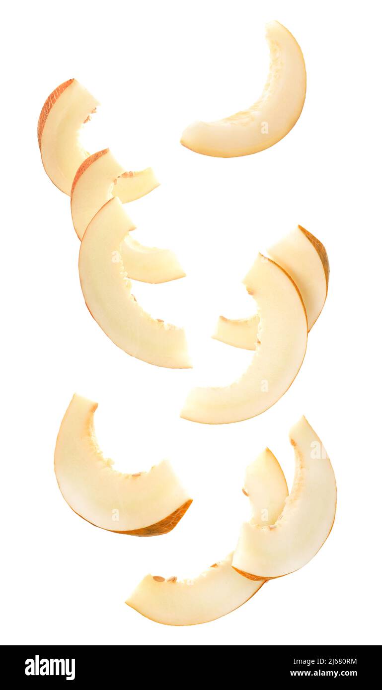 Falling slices of ripe melon isolated on white Stock Photo