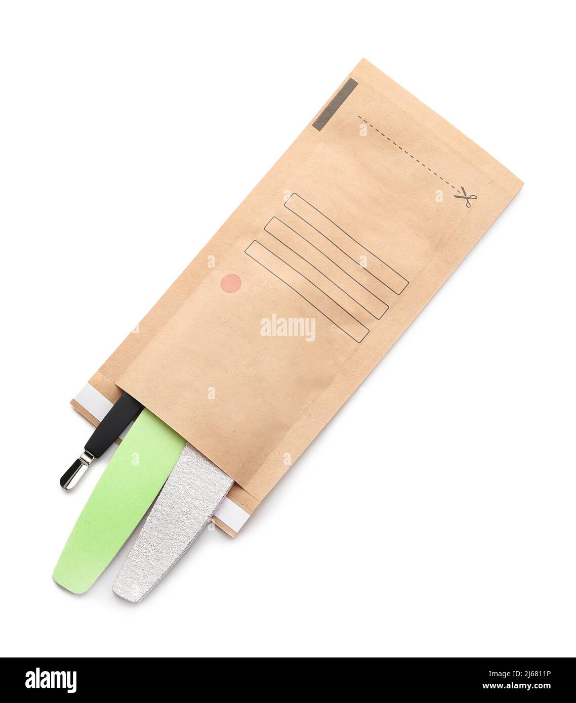 Paper bag with clean manicure tools on white background Stock Photo