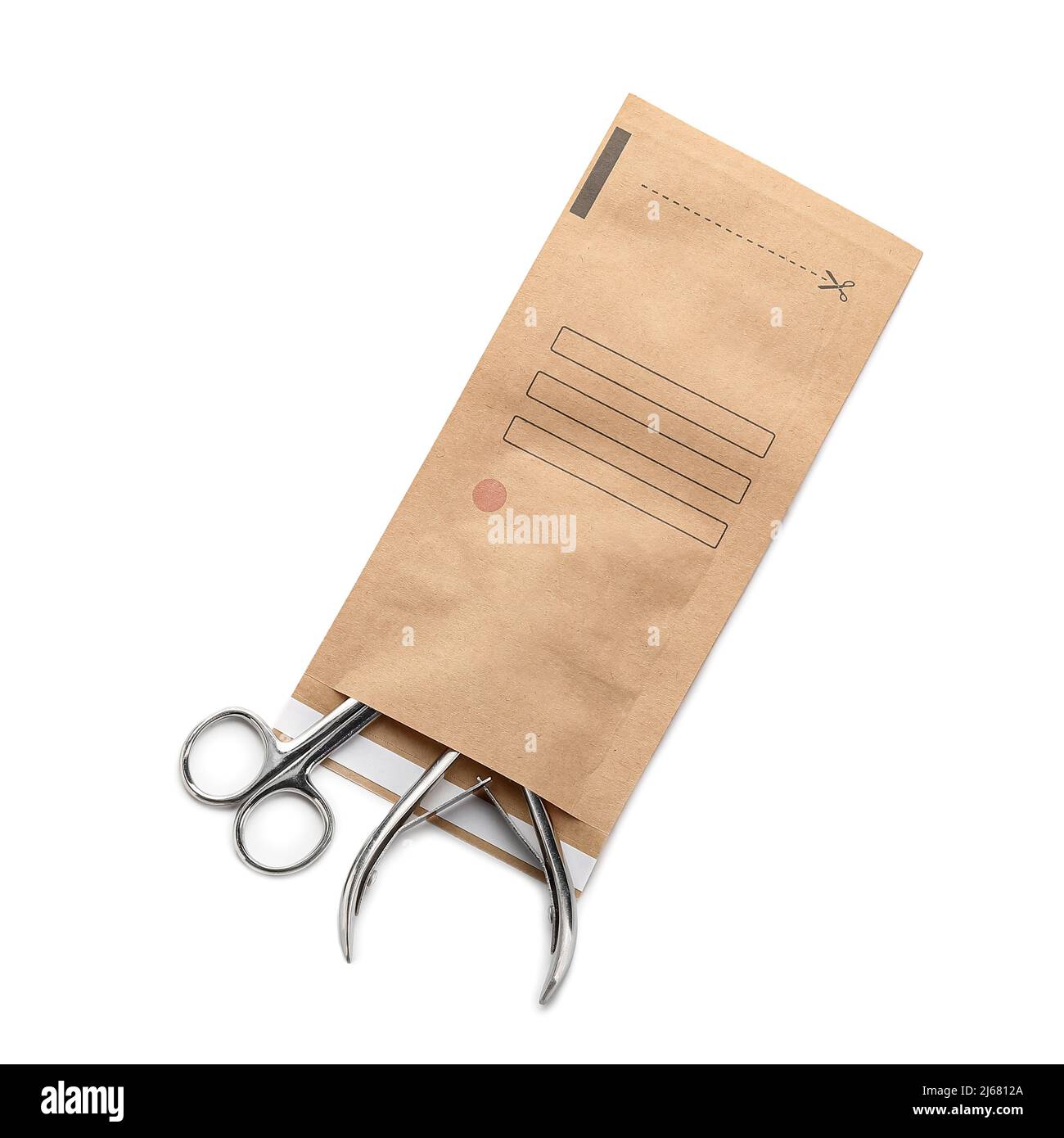 Paper bag with clean manicure tools on white background Stock Photo