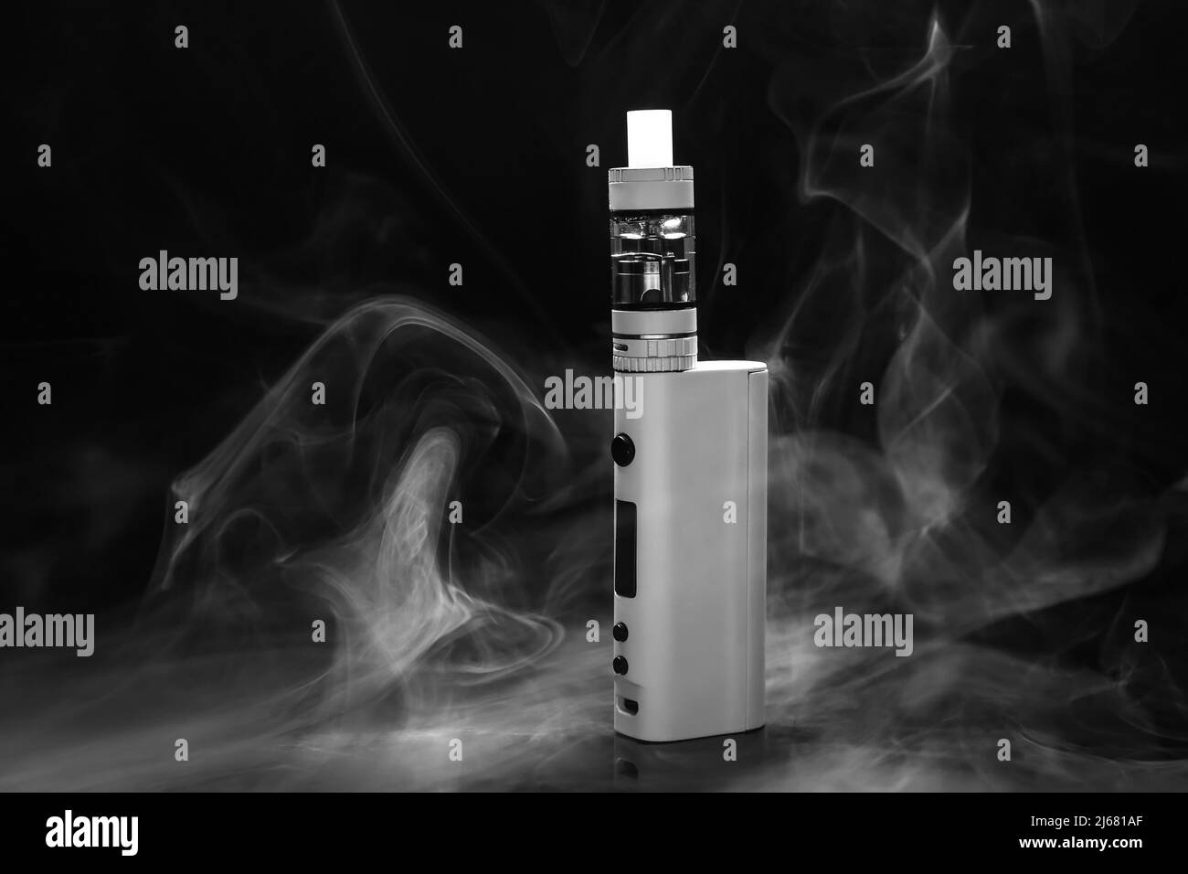 Modern vape mod and smoke on black background Stock Photo